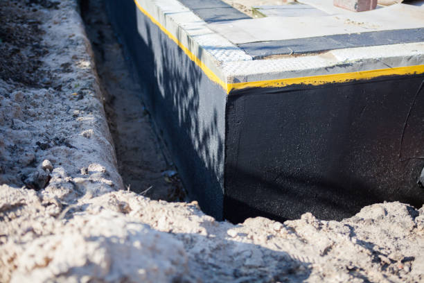 Professional Waterproofing technician working in Davidson, NC